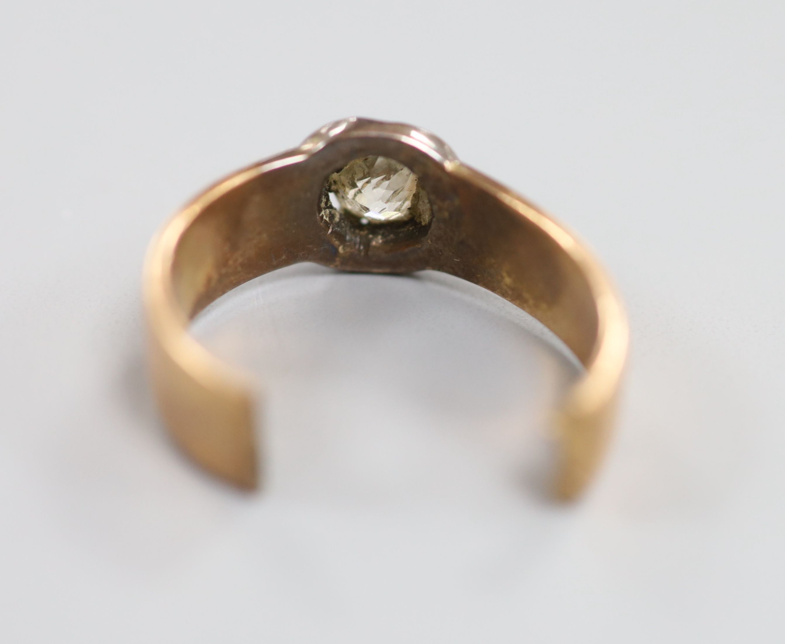 A diamond solitaire and gold ring (tests as 14ct), cut, gross 6.1 grams.